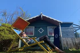 A home owner relaxs in their back garden during lockdown