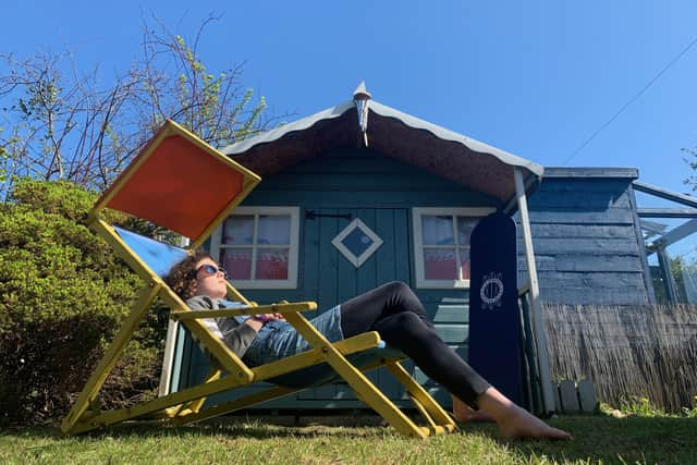 A home owner relaxs in their back garden during lockdown