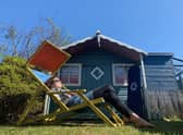A home owner relaxs in their back garden during lockdown