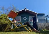 A home owner relaxs in their back garden during lockdown