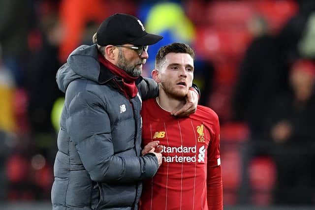 Andy Robertson, right, and Jurgen Klopp feature in a video series which urges football fans to reach out for support when they need it. Picture: Justin Tallis/AFP via Getty Images
