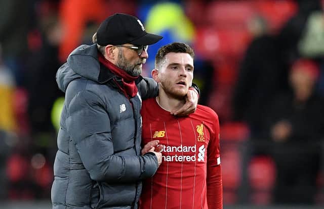 Andy Robertson, right, and Jurgen Klopp feature in a video series which urges football fans to reach out for support when they need it. Picture: Justin Tallis/AFP via Getty Images