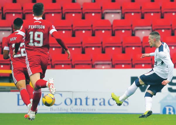 Rangers' Ryan Kent sweeps home the only goal of the game at Pittodrie. Picture: Andrew Milligan/Getty Images