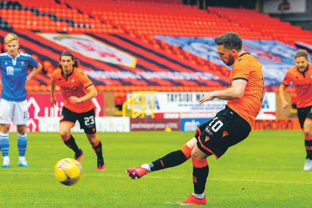 Dundee United's Nicky Clark makes it 1-0 from the penalty spot. Picture: Ross Parker/SNS
