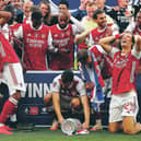 Pierre-Emerick Aubameyang, left, drops the FA Cup during the presentation ceremony. Picture: Catherine Ivill/Getty Images