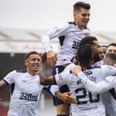 Ryan Kent is engulfed by team-mates after scoring Rangers' winning goal against Aberdeen. Picture: SNS.