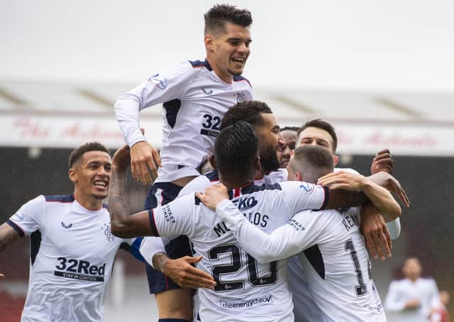 Ryan Kent is engulfed by team-mates after scoring Rangers' winning goal against Aberdeen. Picture: SNS.