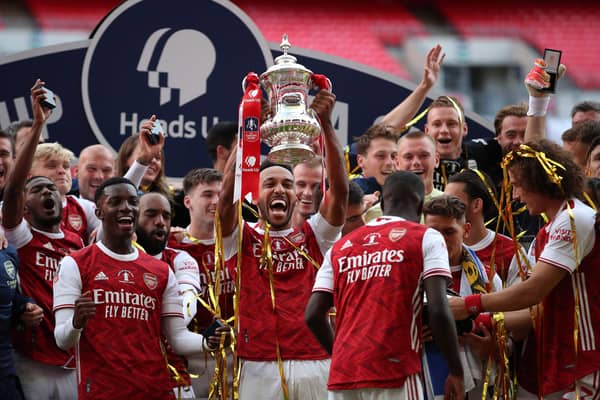 Arsenal captain and man of the match Pierre-Emerick Aubameyang holds the trophy aloft as the Gunners celebrate their victory over Chelsea in Saturday’s FA Cup final at Wembley. AFP/Getty