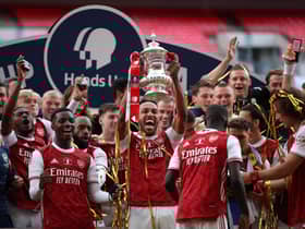 Arsenal captain and man of the match Pierre-Emerick Aubameyang holds the trophy aloft as the Gunners celebrate their victory over Chelsea in Saturday’s FA Cup final at Wembley. AFP/Getty