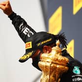 Lewis Hamilton celebrates with a black power salute after winning his seventh British Grand Prix. Picture: Bryn Lennon/Getty Images