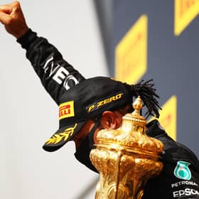 Lewis Hamilton celebrates with a black power salute after winning his seventh British Grand Prix. Picture: Bryn Lennon/Getty Images