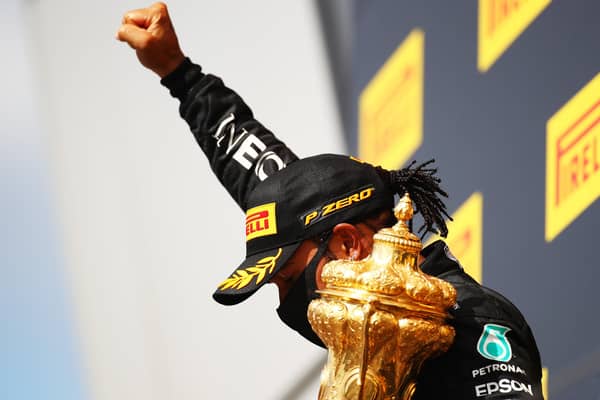 Lewis Hamilton celebrates with a black power salute after winning his seventh British Grand Prix. Picture: Bryn Lennon/Getty Images