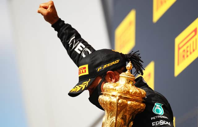 Lewis Hamilton celebrates with a black power salute after winning his seventh British Grand Prix. Picture: Bryn Lennon/Getty Images