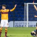 Motherwell’s Callum Lang can’t believe he’s being shown a red card by referee Nick Walsh