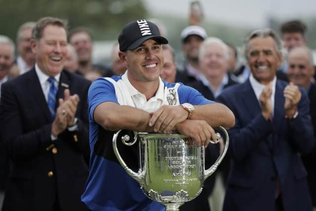 Brooks Koepka poses with the Wanamaker Trophy after winning the US PGA Championship at Bethpage Black in 2019. Koepka is bidding to win the title for the third consecutive year. Picture: AP Photo/Julio Cortez, FIle