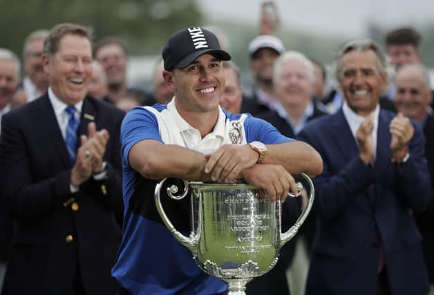 Brooks Koepka poses with the Wanamaker Trophy after winning the US PGA Championship at Bethpage Black in 2019. Koepka is bidding to win the title for the third consecutive year. Picture: AP Photo/Julio Cortez, FIle