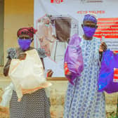 Women in Nigeria are pleased to receive a package of essential items. Each registered household includes soap, body lotion, tissue paper, toothbrush and toilet paste and flipflops. Households with women and babies received sanitary towels and nappies. Christian Aid/Jerry Clinton
