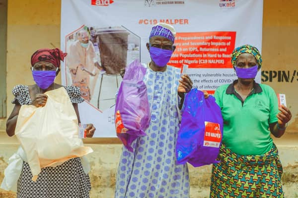 Women in Nigeria are pleased to receive a package of essential items. Each registered household includes soap, body lotion, tissue paper, toothbrush and toilet paste and flipflops. Households with women and babies received sanitary towels and nappies. Christian Aid/Jerry Clinton