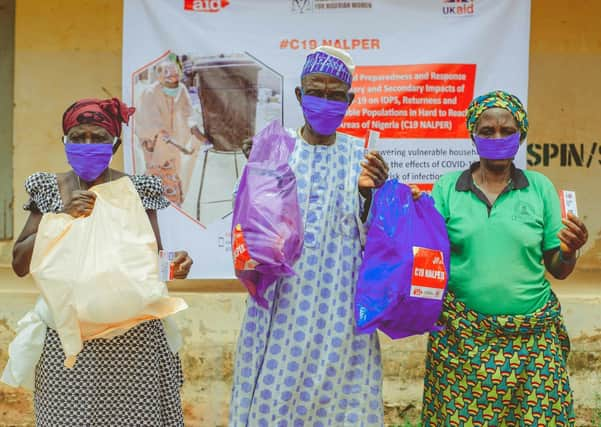 Women in Nigeria are pleased to receive a package of essential items. Each registered household includes soap, body lotion, tissue paper, toothbrush and toilet paste and flipflops. Households with women and babies received sanitary towels and nappies. Christian Aid/Jerry Clinton