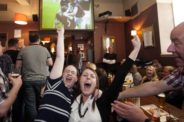 Pubs have rallied fans back to the cause, but Iain McMenemy argues that football clubs offer more to the community than the pubs. Picture: SNS.