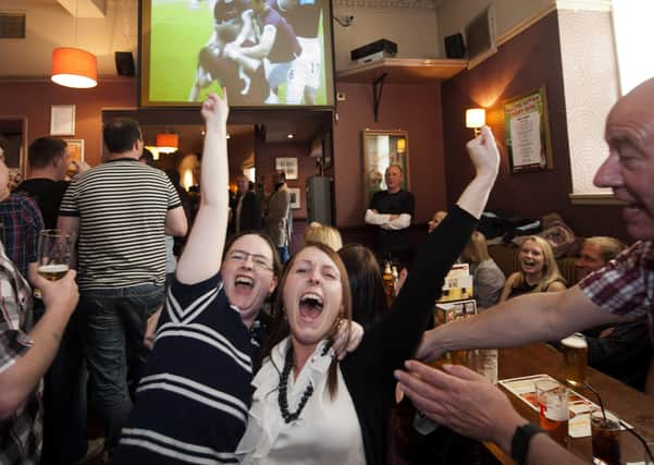 Pubs have rallied fans back to the cause, but Iain McMenemy argues that football clubs offer more to the community than the pubs. Picture: SNS.