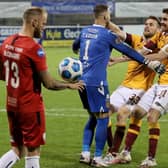 Stephen O'Donnell and Declan Gallagher rush to congratulate Trevor Carson after the keeper's penalty shootout heroics for Motherwell. Picture: Brian Lawless/PA Wire