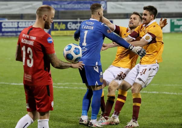 Stephen O'Donnell and Declan Gallagher rush to congratulate Trevor Carson after the keeper's penalty shootout heroics for Motherwell. Picture: Brian Lawless/PA Wire