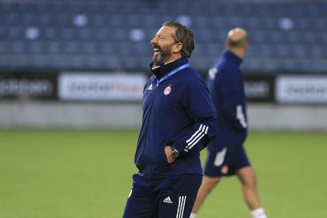 Aberdeen manager Derek McInnes, enjoying a laugh during training, wants as many Scottish clubs as possible to do well in Europe. Picture: Getty.