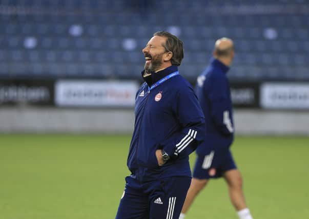 Aberdeen manager Derek McInnes, enjoying a laugh during training, wants as many Scottish clubs as possible to do well in Europe. Picture: Getty.