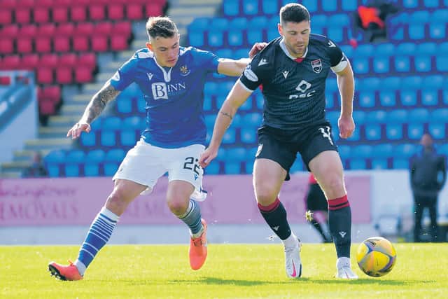 Ross County's goalscorer Iain Vigurs, right, shields the ball from St Johnstone's Callum Hendry. Picture: Ross MacDonald/SNS