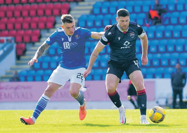 Ross County's goalscorer Iain Vigurs, right, shields the ball from St Johnstone's Callum Hendry. Picture: Ross MacDonald/SNS