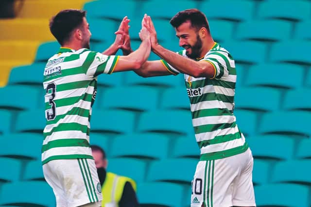 Albian Ajeti celebrates making it 3-1 to Celtic with Greg Taylor (left). Photo by Rob Casey / SNS Group