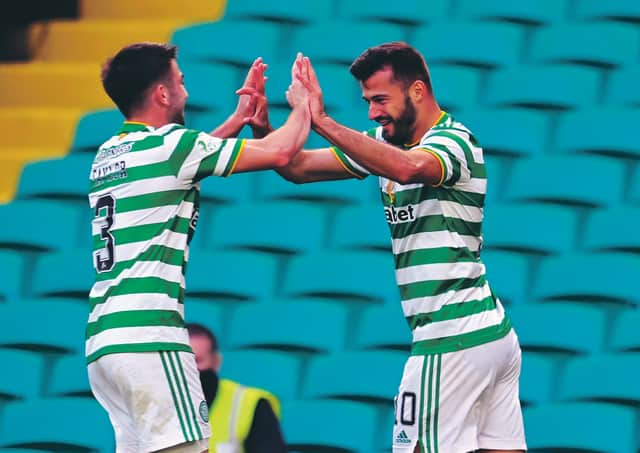 Albian Ajeti celebrates making it 3-1 to Celtic with Greg Taylor (left). Photo by Rob Casey / SNS Group