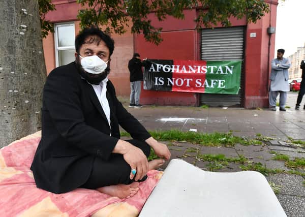 Abdul Rahman Safi, 59, sits in front of the Home Office building in Glasgow's Brand Street. Picture: John Devlin