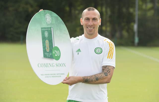 Celtic captain Scott Brown promotes the club's forthcoming book about nine in a row. Picture: Craig Foy/SNS