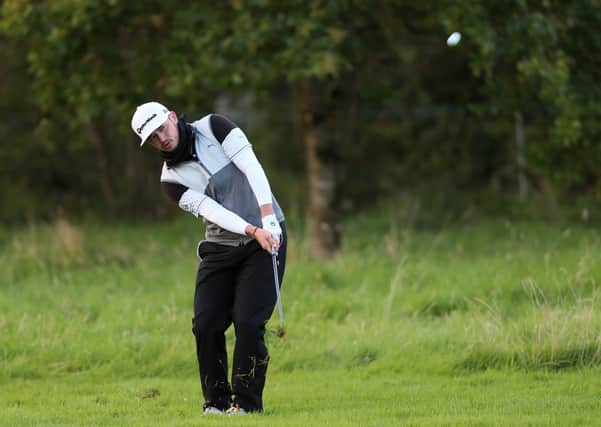 Ewen Ferguson plays his pitch to the 18th green during his second round at Galgorm Castle. Picture: PA