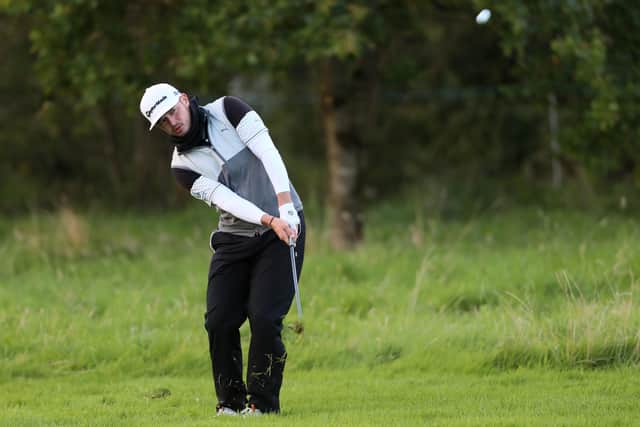 Ewen Ferguson plays his pitch to the 18th green during his second round at Galgorm Castle. Picture: PA