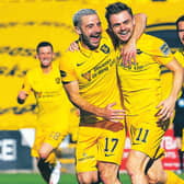 Livingston scorer Alan Forrest (11) celebrates with Scott Robinson. Picture: Ross Parker/SNS Group