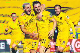 Livingston scorer Alan Forrest (11) celebrates with Scott Robinson. Picture: Ross Parker/SNS Group