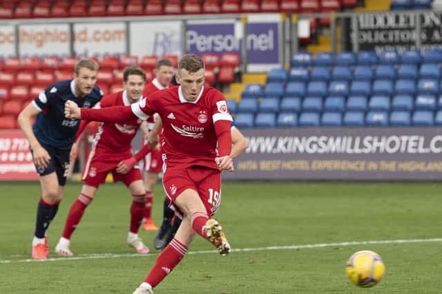 Lewis Ferguson scores from the penalty spot to seal Aberdeen's 3-0 victory. Picture: SNS.