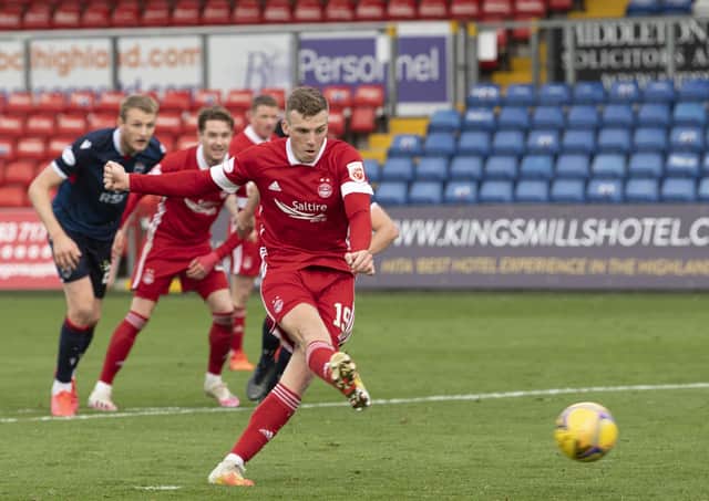 Lewis Ferguson scores from the penalty spot to seal Aberdeen's 3-0 victory. Picture: SNS.