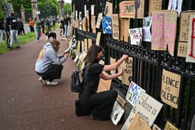 Black Lives Matter protesters hang their banners on the fence of Holyrood Palace. Picture: Jeff J Mitchell/Getty Images