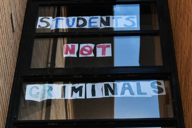 Students at Glasgow University's Murano Street residence complain to the world that they are being treated like criminals (Picture: John Devlin)