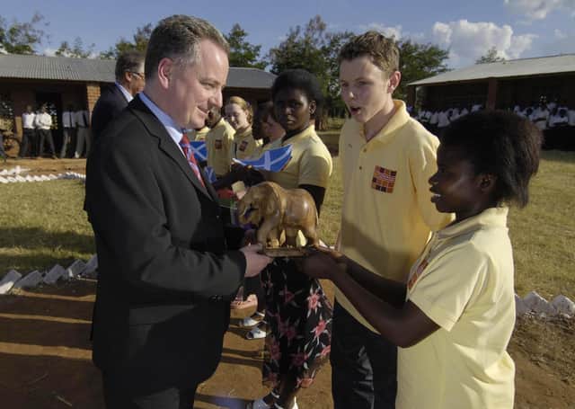 The then First Minister Jack McConnell meets Malawian and Scottish children at Minga Secondary School, Malawi, which is twinned with a school in Orkney, in 2005 (Picture: Donald MacLeod/The Scotsman/Pool/PA.