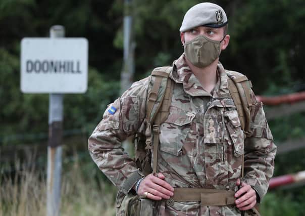 A soldier from the Royal Scots Dragoon Guards wearing a face mask during Exercise Solway Eagle