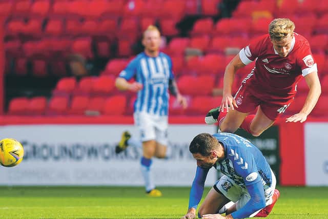 Kilmarnock's Kirk Broadfoot and Aberdeen's Ross McCrorie collide. Both players were forced off injured as a result of the clash. Picture: Ross MacDonald/SNS Group