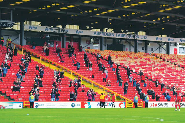 300 Aberdeen supporters gathered in the South Stand as fans returned to Pittodrie for the first time since March. Picture: Ross MacDonald/SNS Group