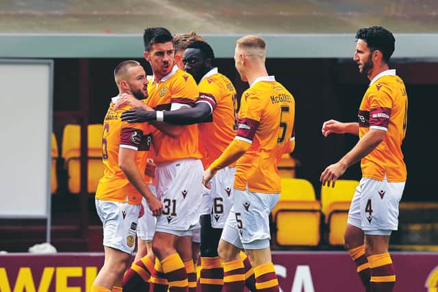Motherwell players come together to celebrate Allan Campbell's goal. Picture: Rob Casey/SNS