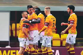 Motherwell players come together to celebrate Allan Campbell's goal. Picture: Rob Casey/SNS