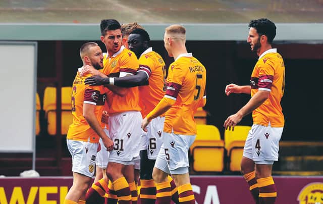 Motherwell players come together to celebrate Allan Campbell's goal. Picture: Rob Casey/SNS